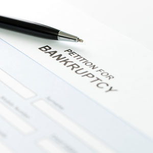 Chapter 11 Subchapter 5 bankruptcy document on desk with black pen